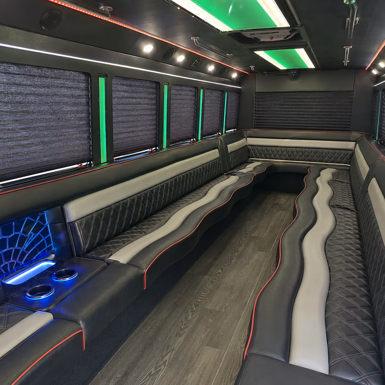 Friends laughing during a party bus celebration in Glendale